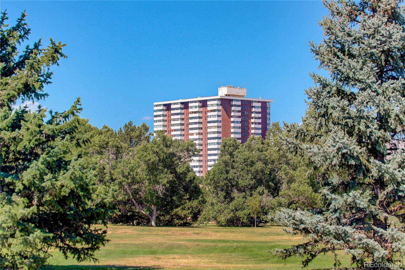 a view of a large building with a yard