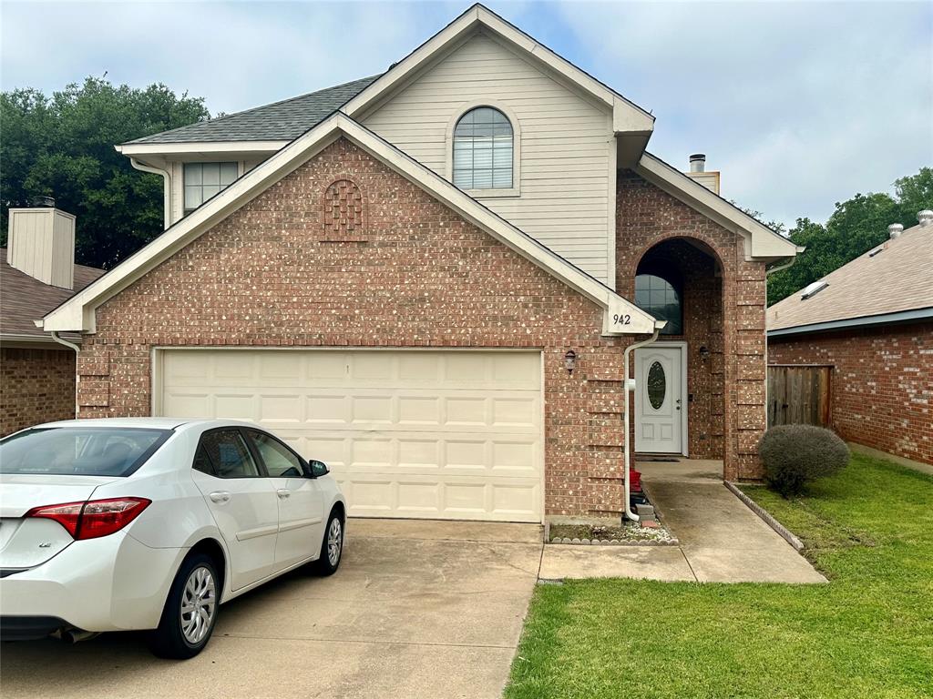 a view of a car in front of a house