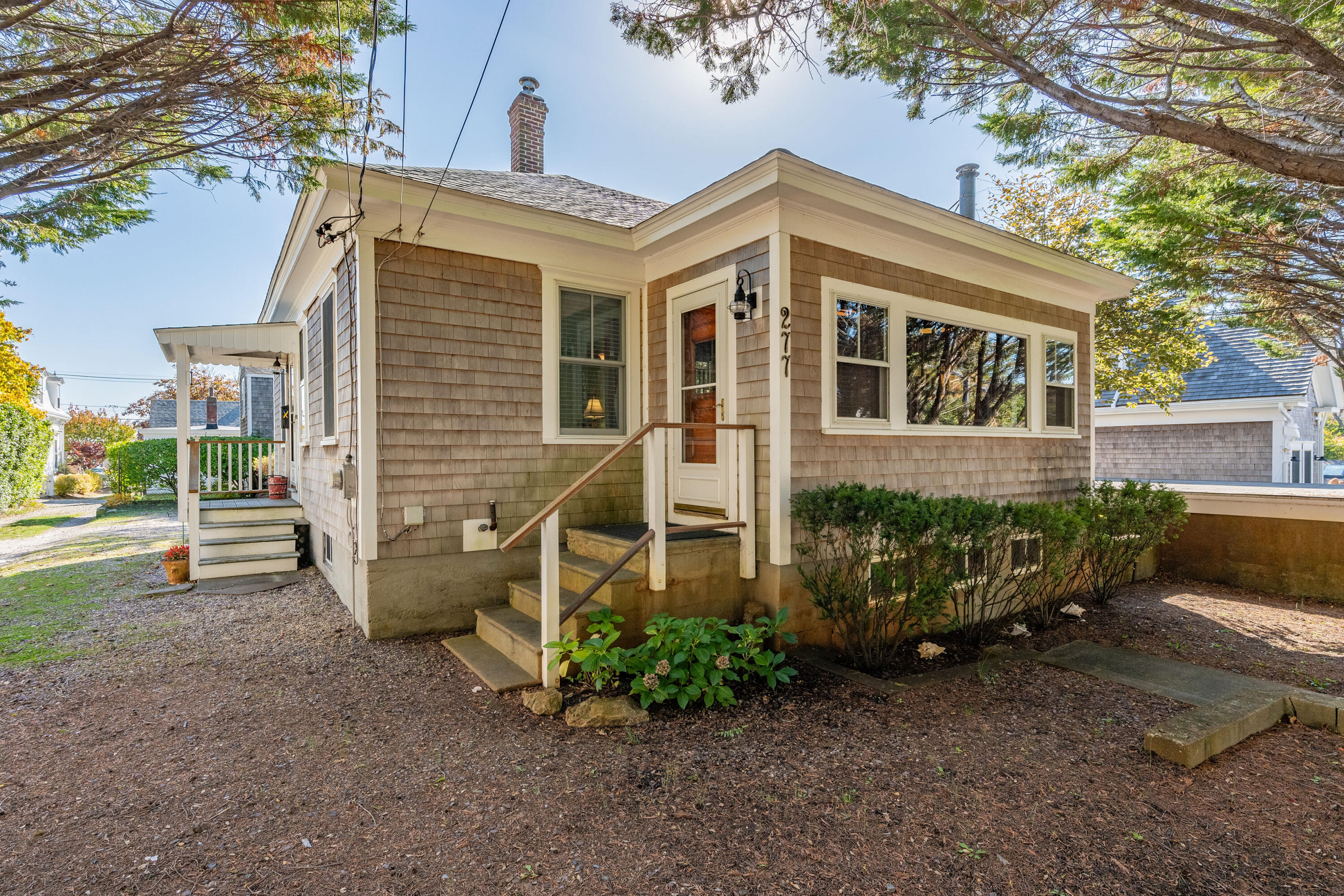 front view of a house with a yard