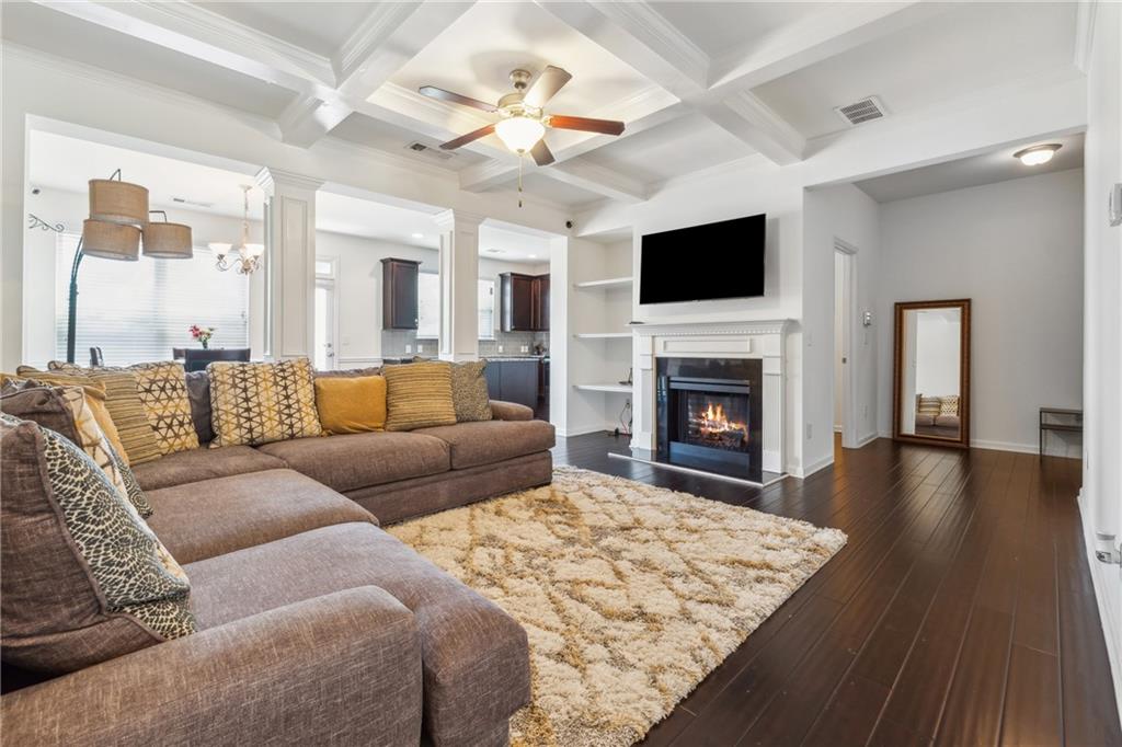 a living room with a flat screen tv and a fireplace