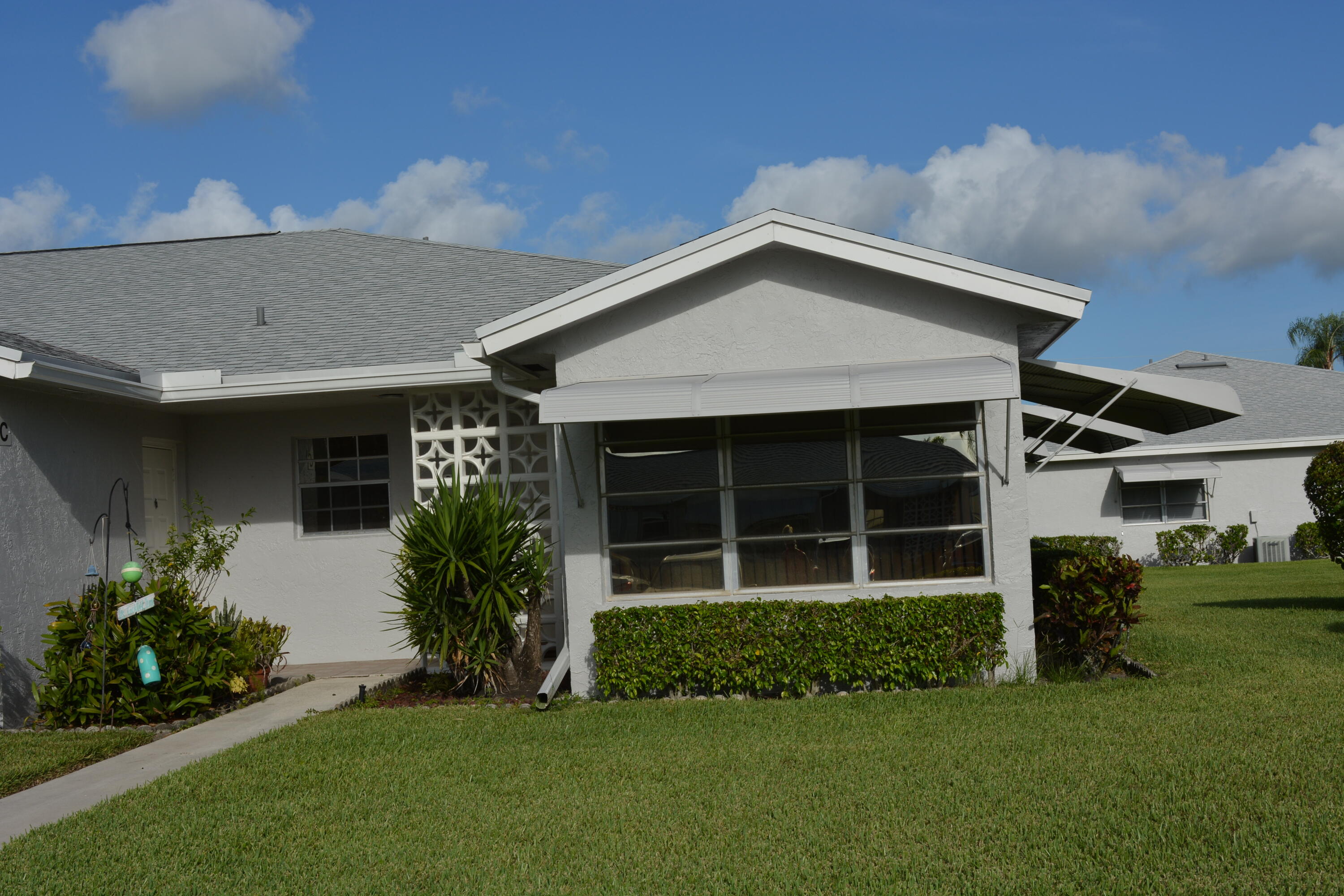 front view of a house with a yard