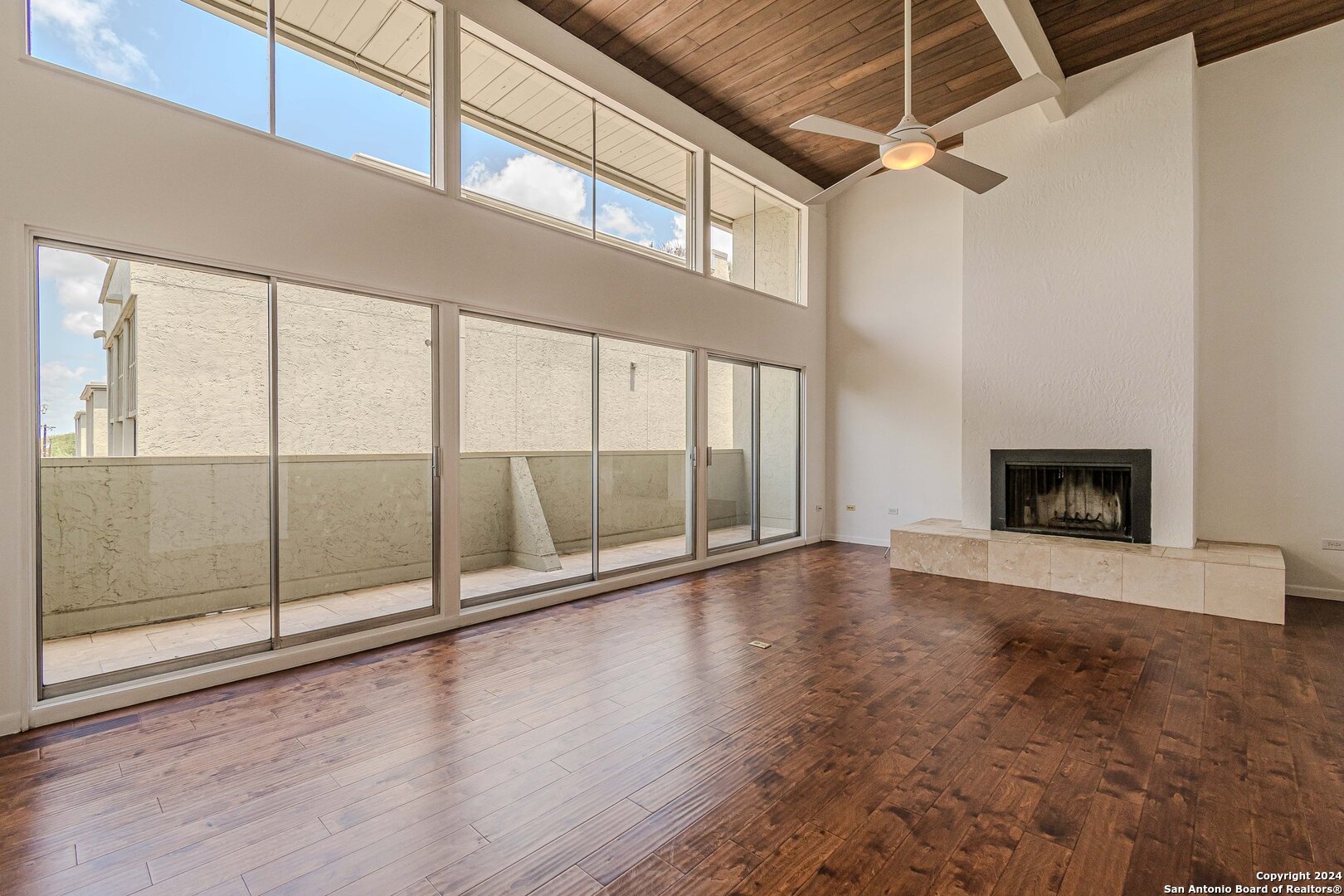 a view of an empty room with glass door