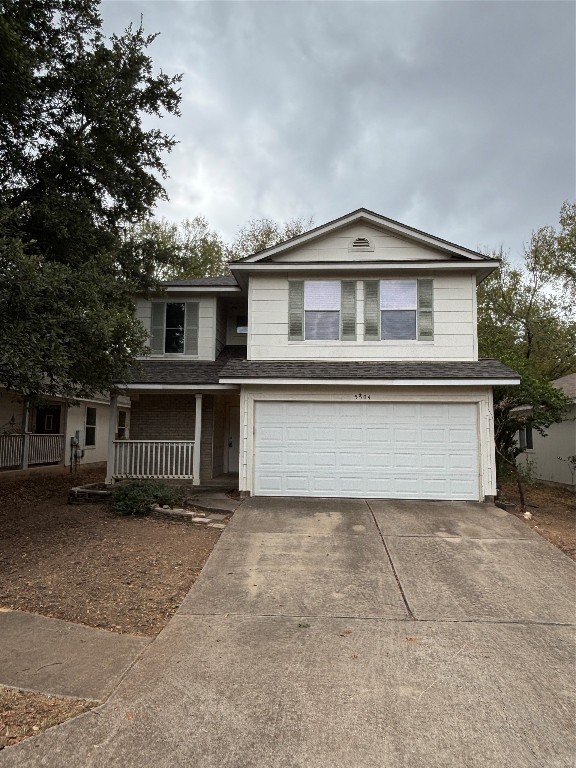 a front view of a house with a garage