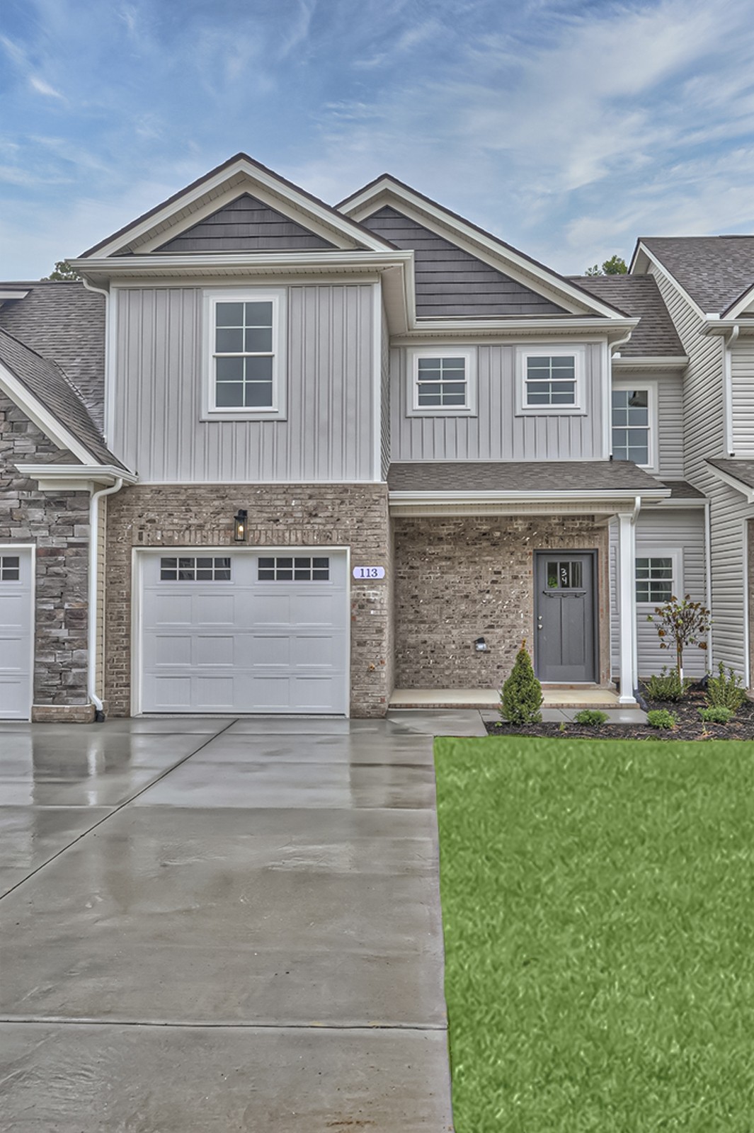 a front view of a house with a yard