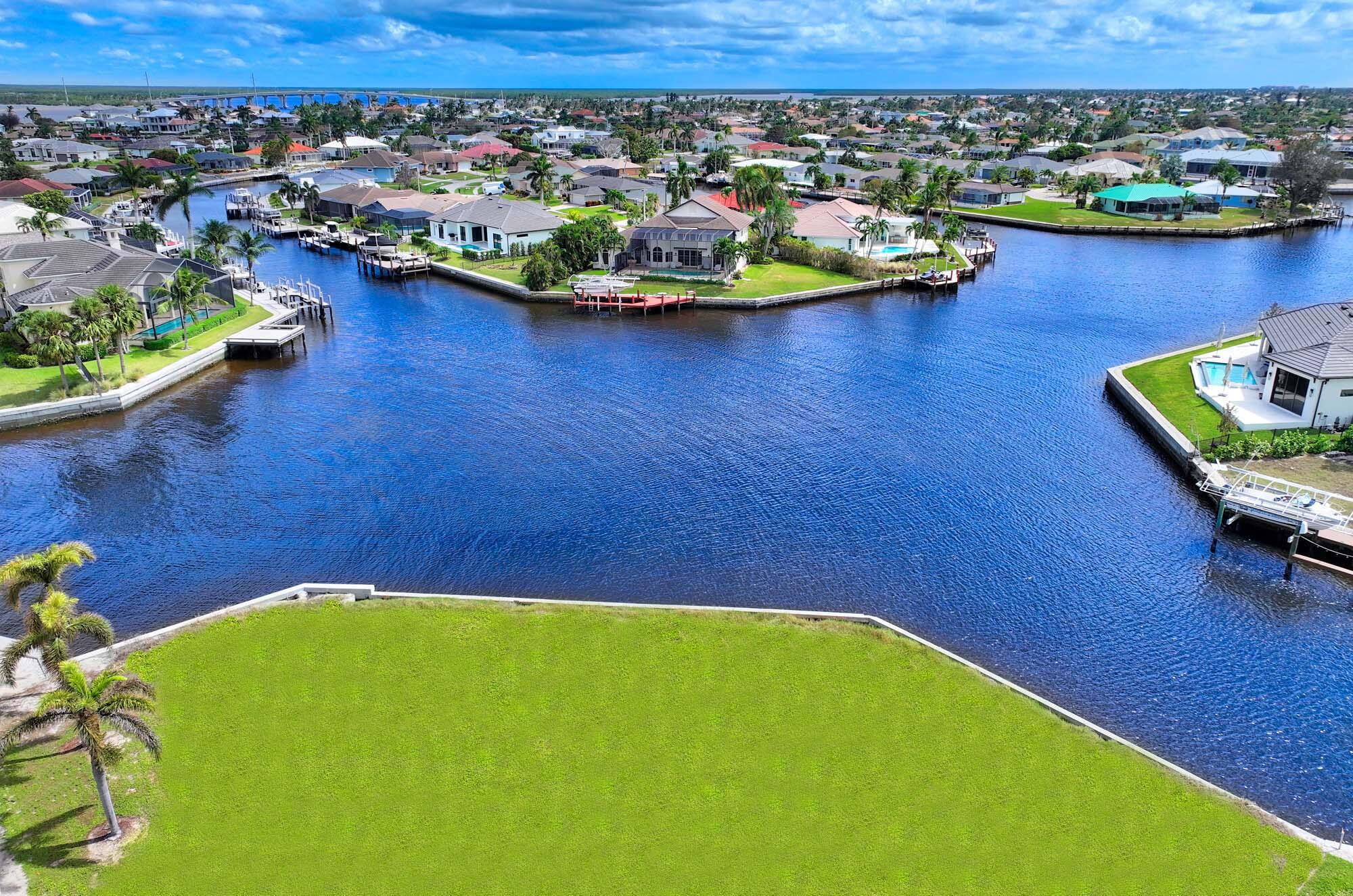 view of a lake with a table and chairs