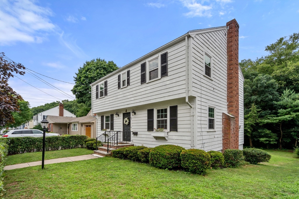 a front view of a house with a yard