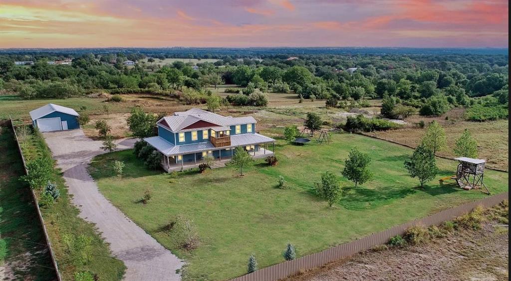 an aerial view of a house with a garden