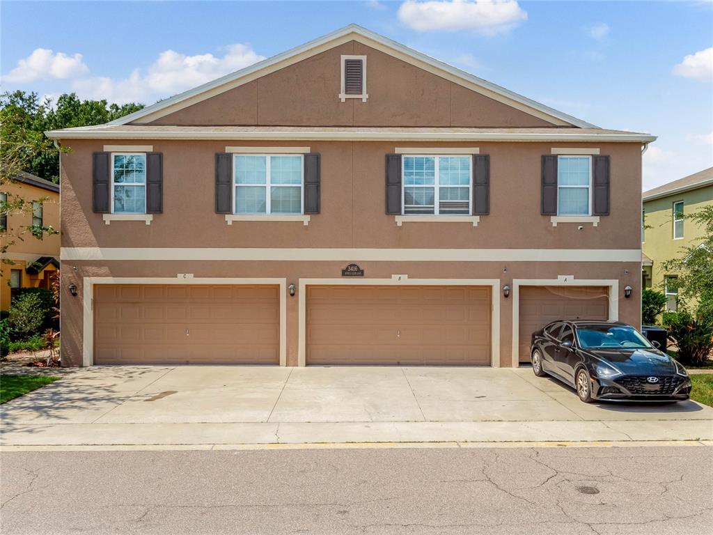 a front view of a house with a garage