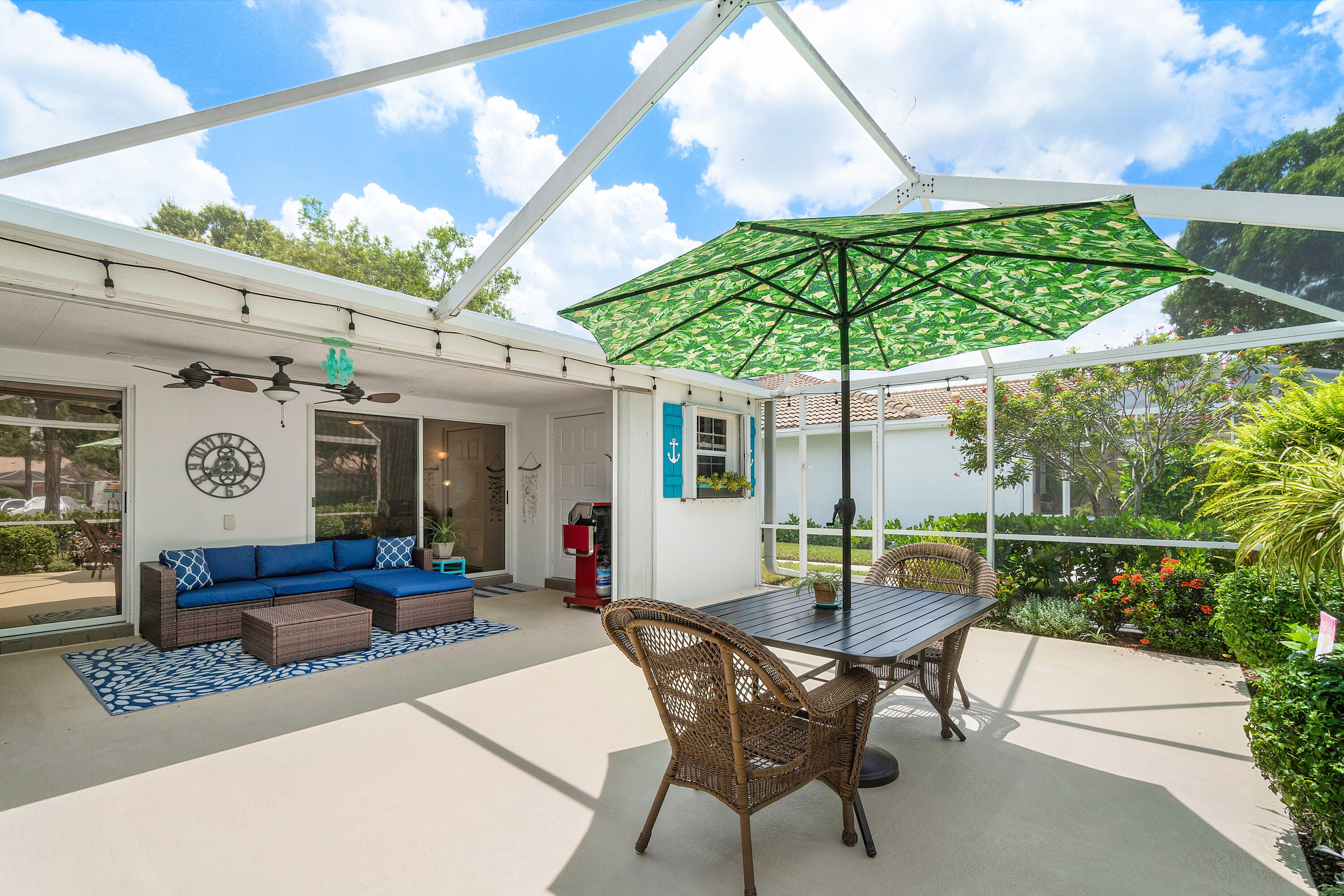 a patio with a table and chairs