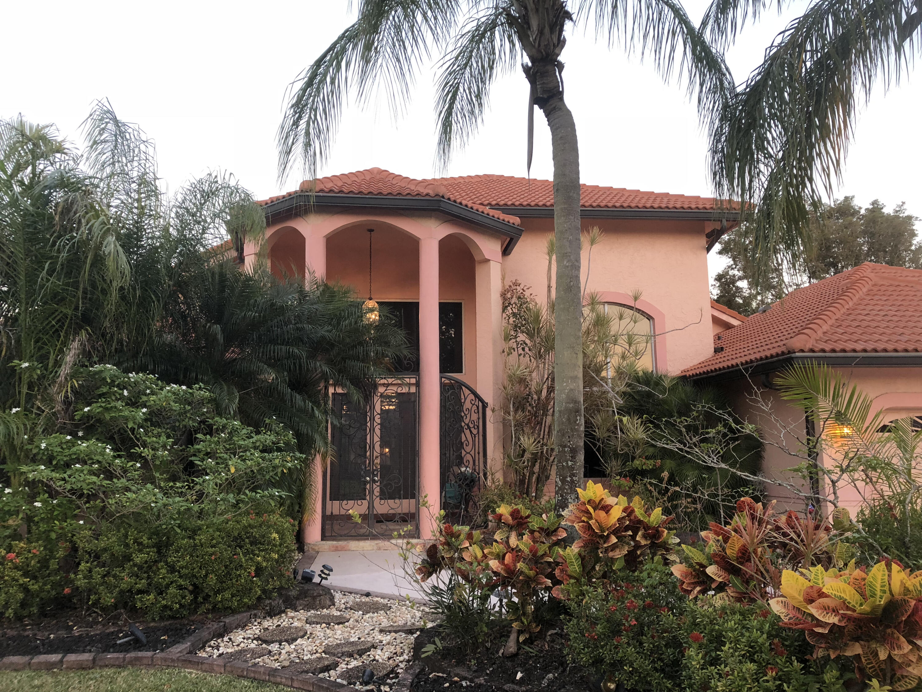 a front view of a house with yard and entryway