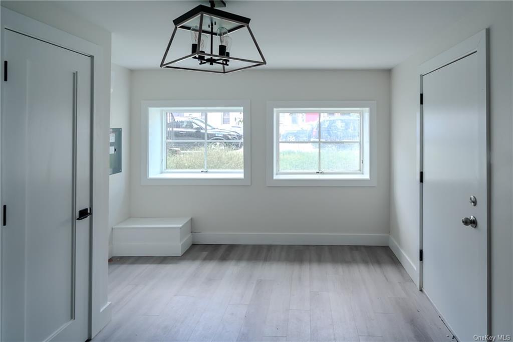 a view of room with window and ceiling fan