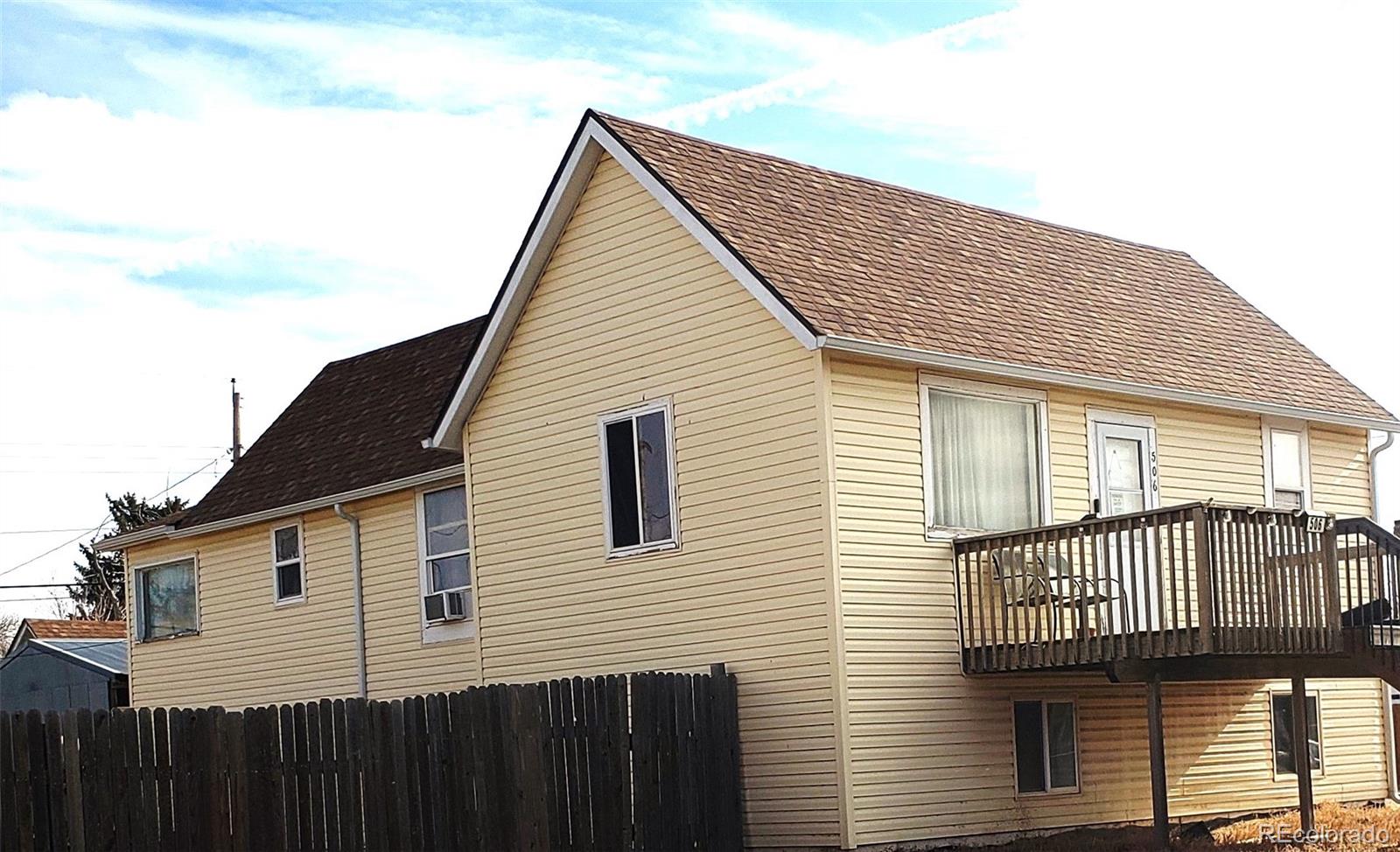 a view of a house with a roof deck