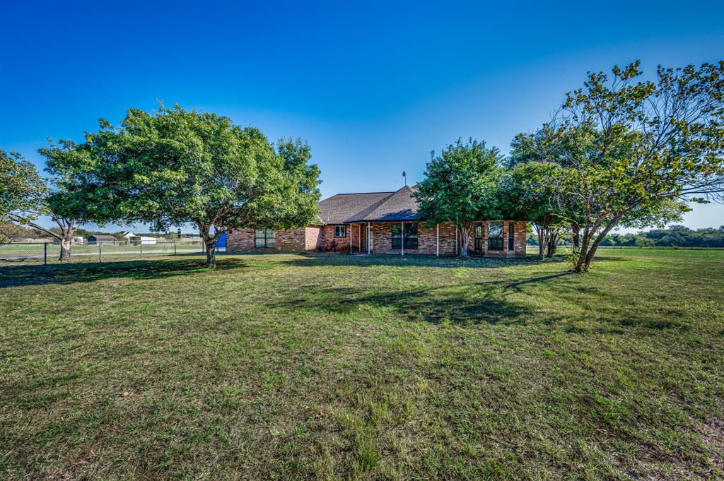 a view of a house with a big yard