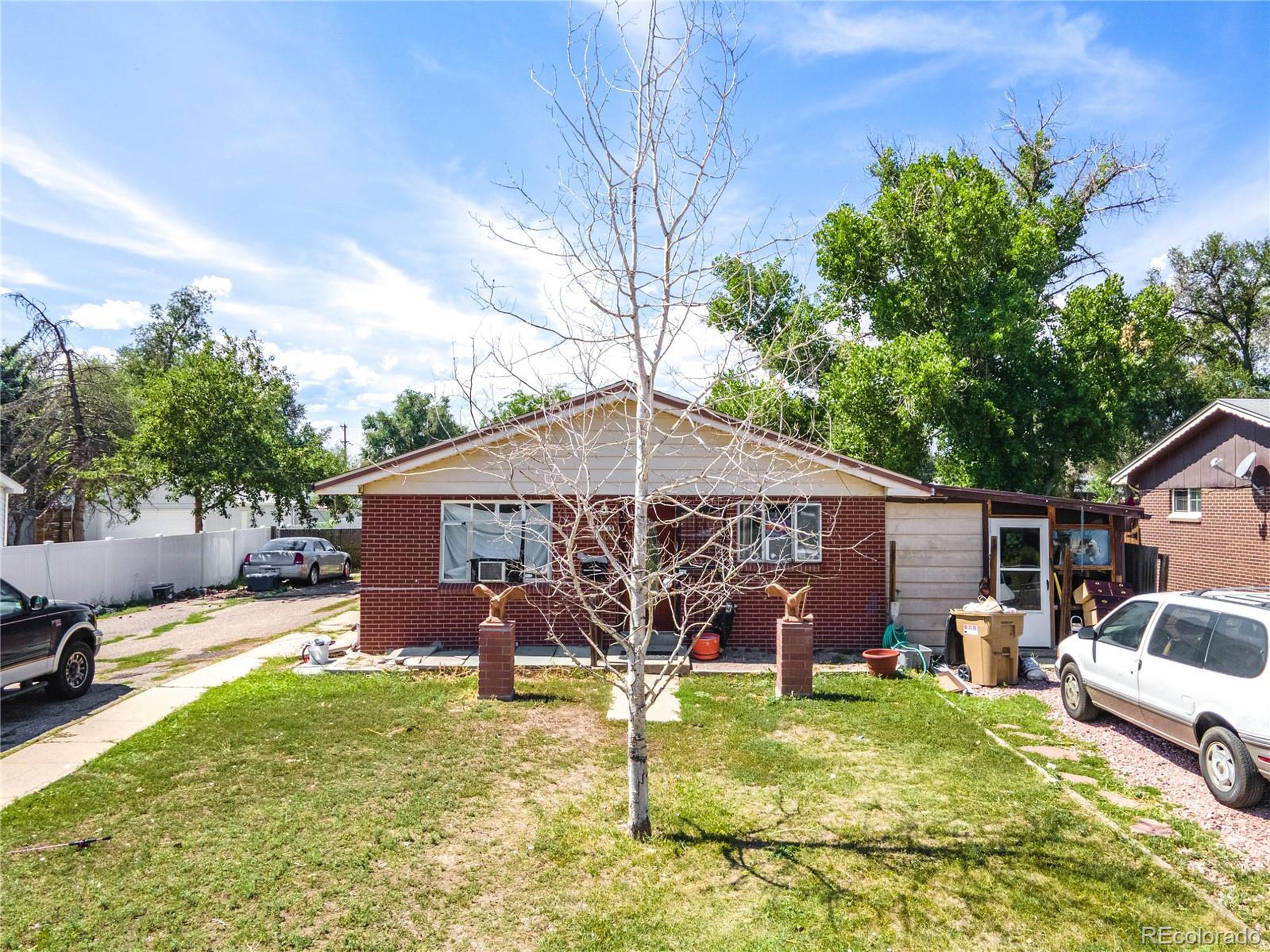 front view of a house with a yard