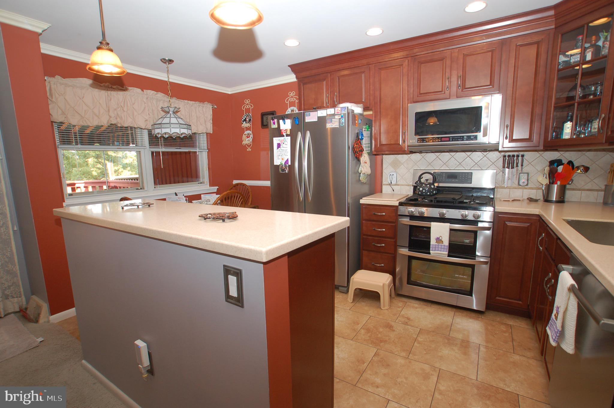 a kitchen with a sink and stainless steel appliances