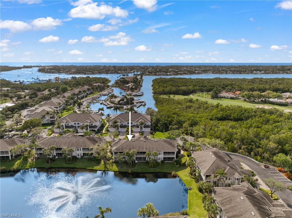 an aerial view of residential building and lake