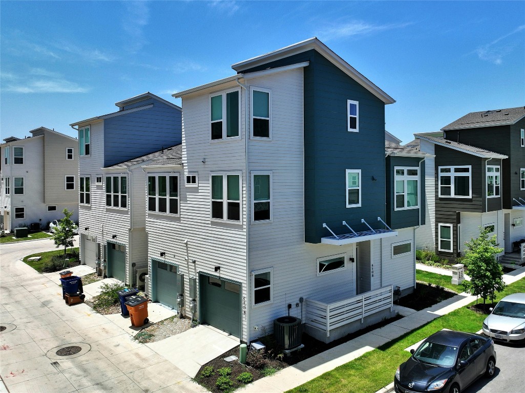 a front view of a house with yard outdoor seating and barbeque oven