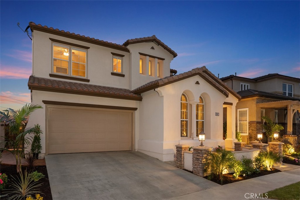 a front view of a house with parking