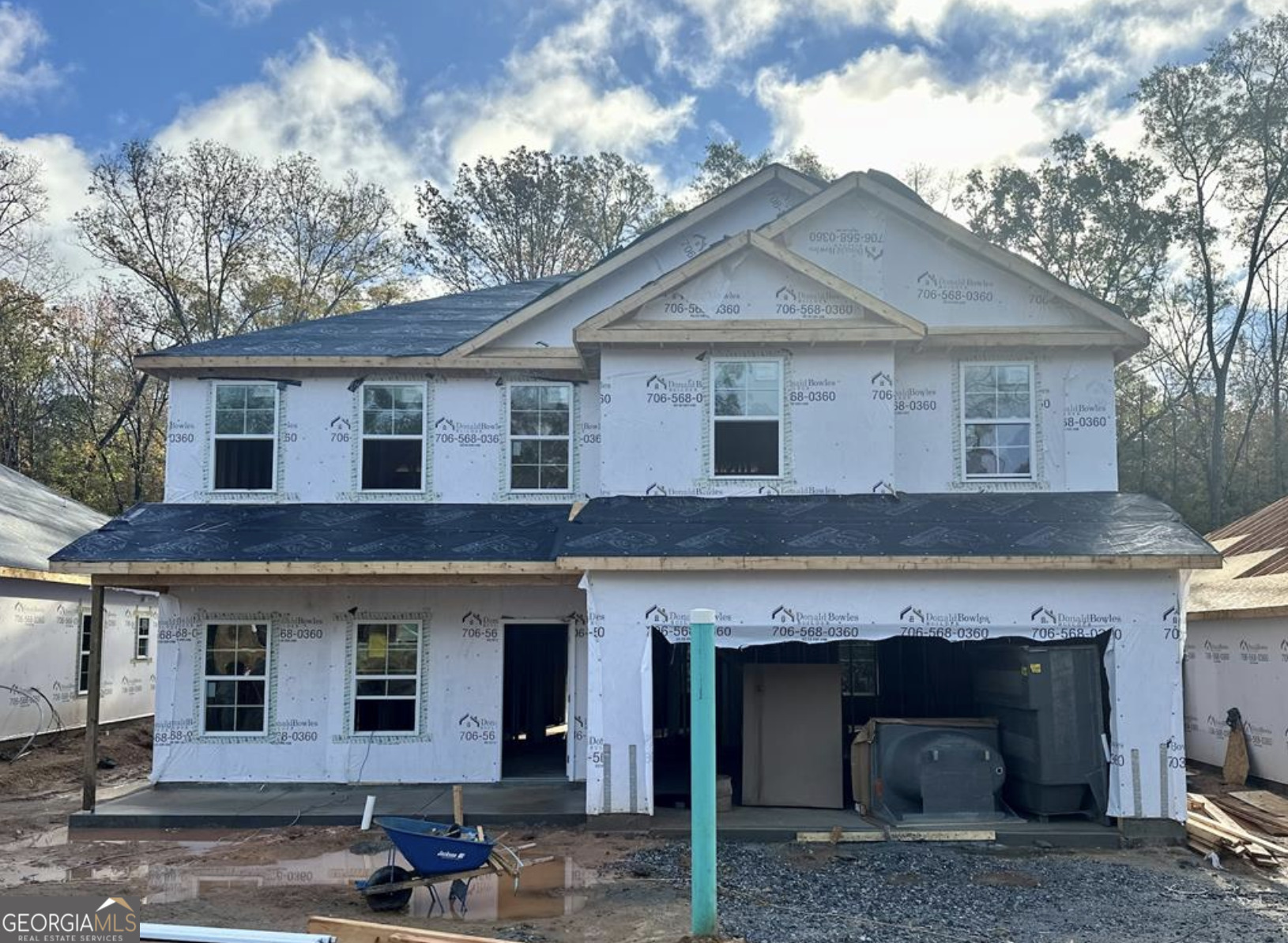 a front view of a house with garage