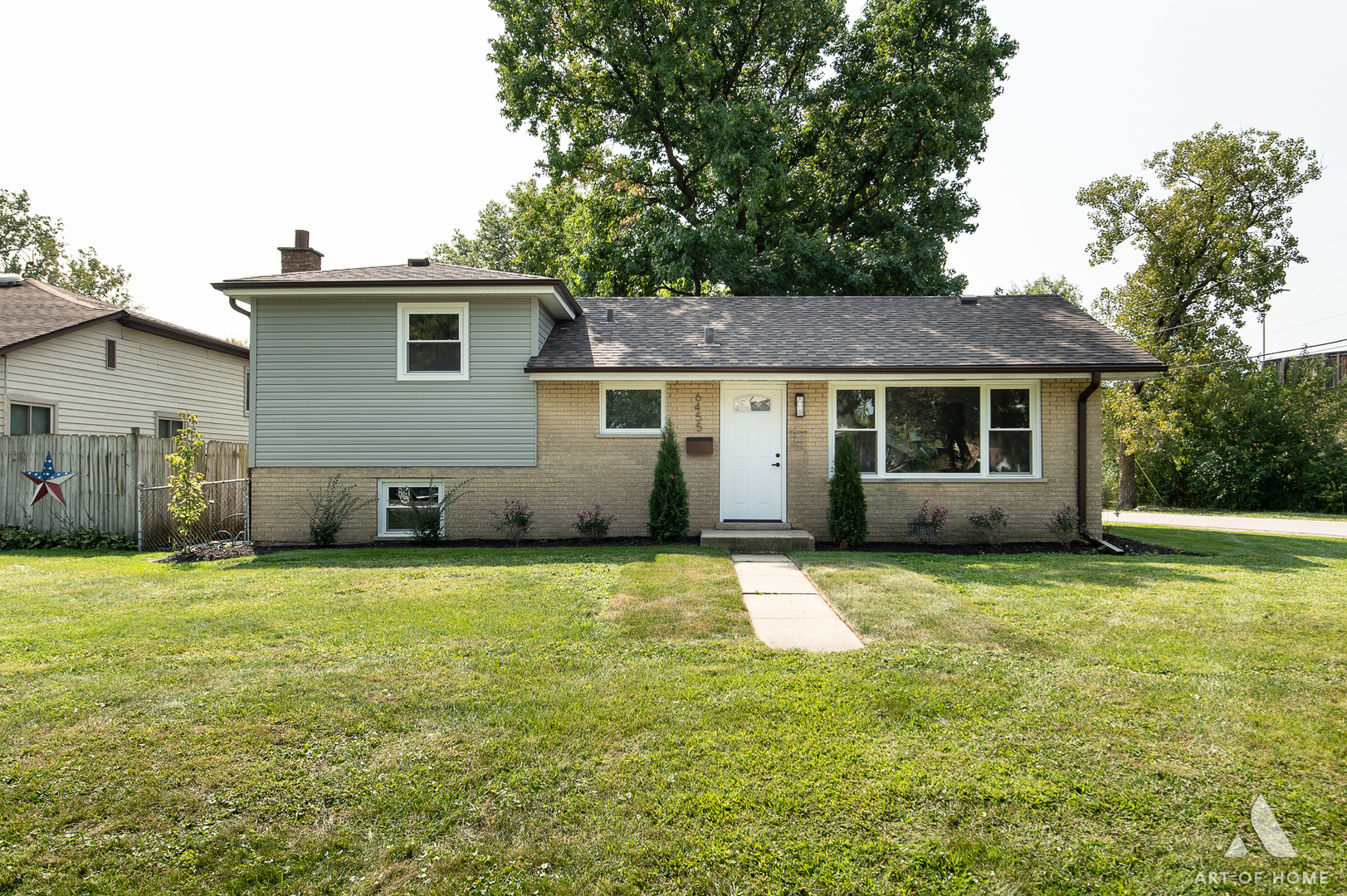 a house that has a big yard in front of it