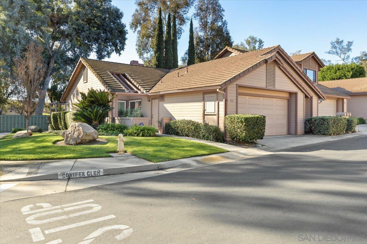 a view of a house and a yard