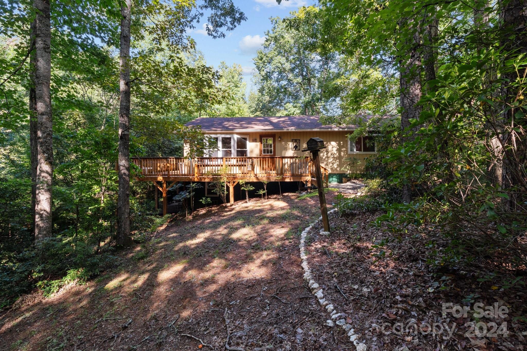 a view of a house with a backyard