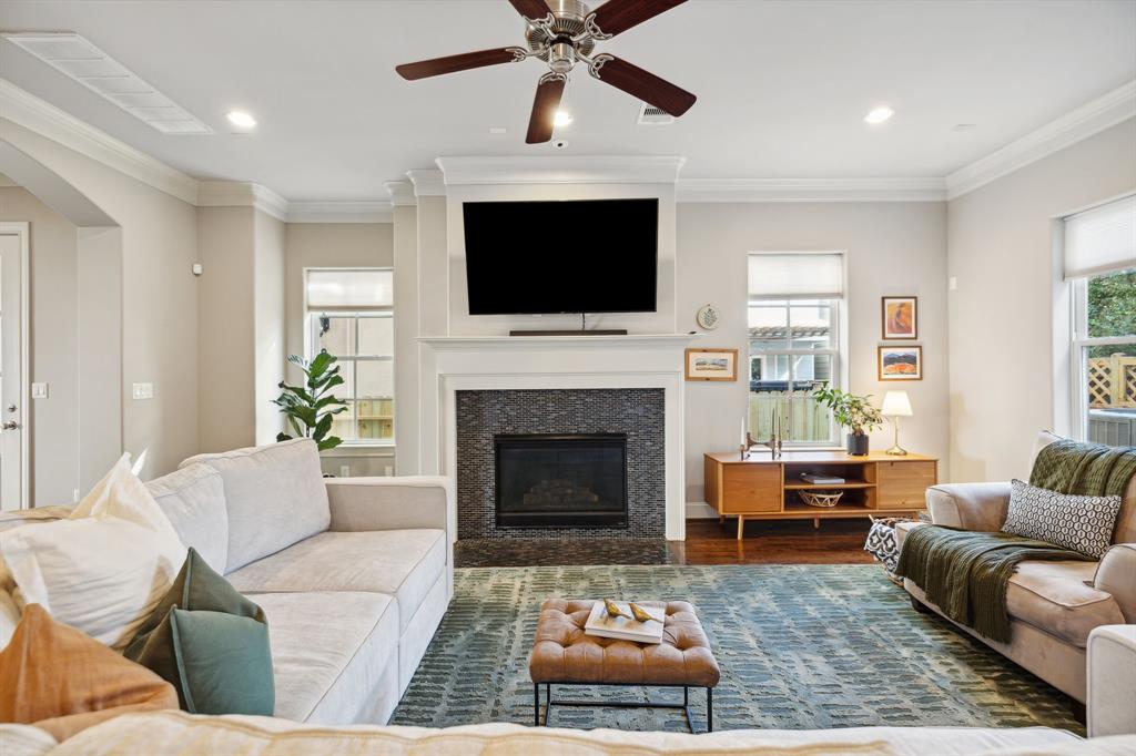 a living room with furniture fireplace and a flat screen tv