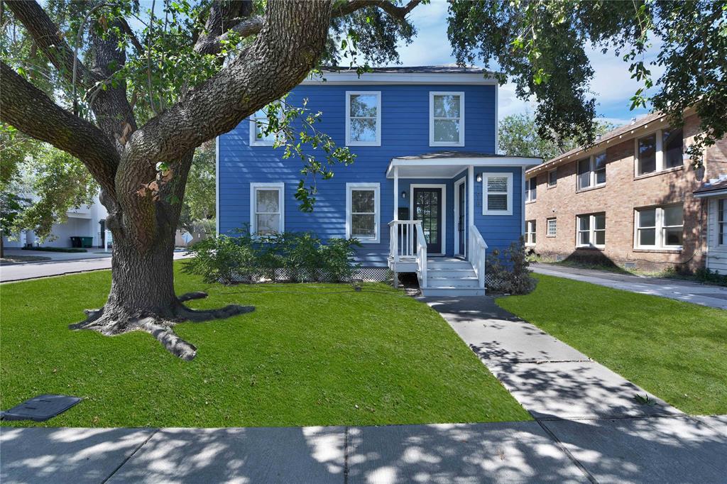 front view of a house with a yard