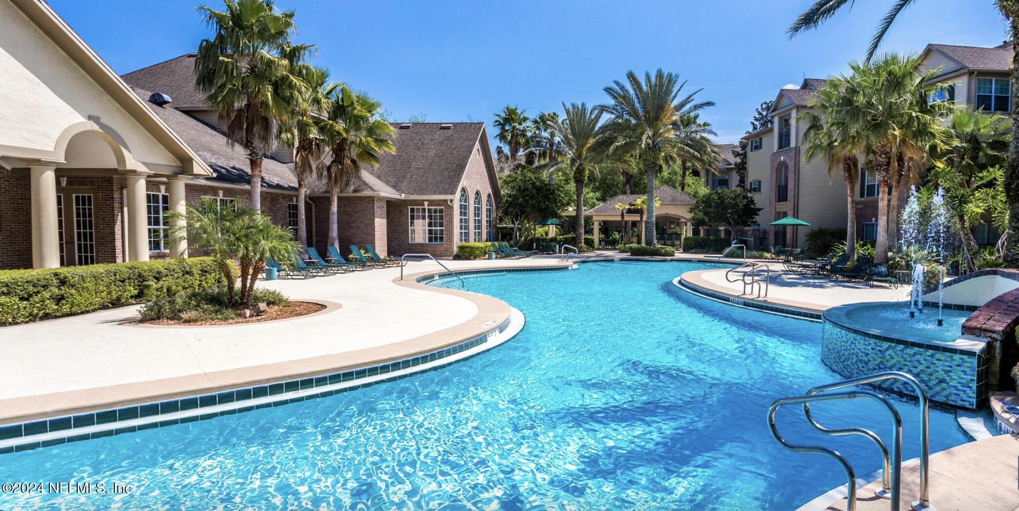 a view of a house with swimming pool patio and swimming pool