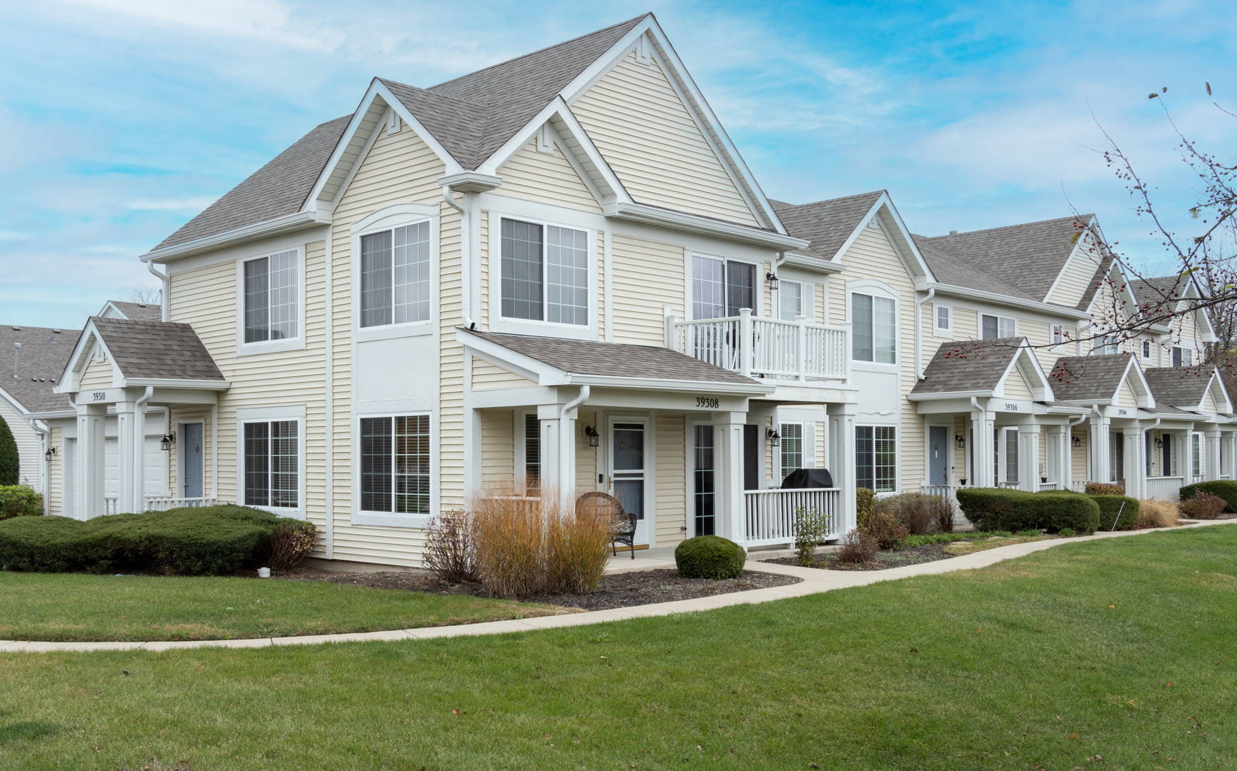 a front view of a house with a yard