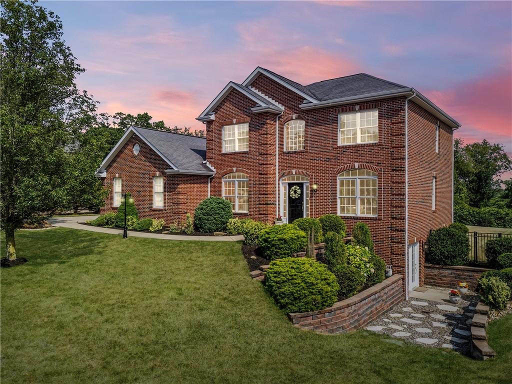 a front view of a house with a yard