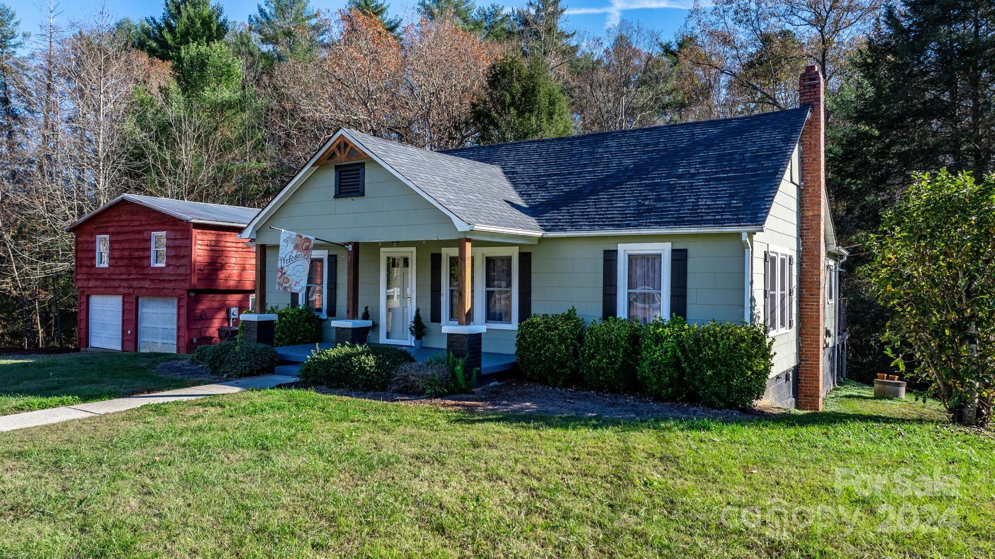 a front view of a house with garden