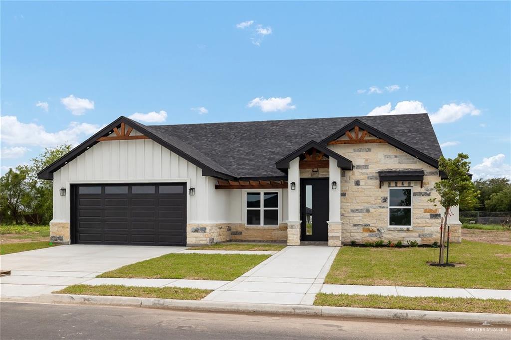 a front view of a house with garage