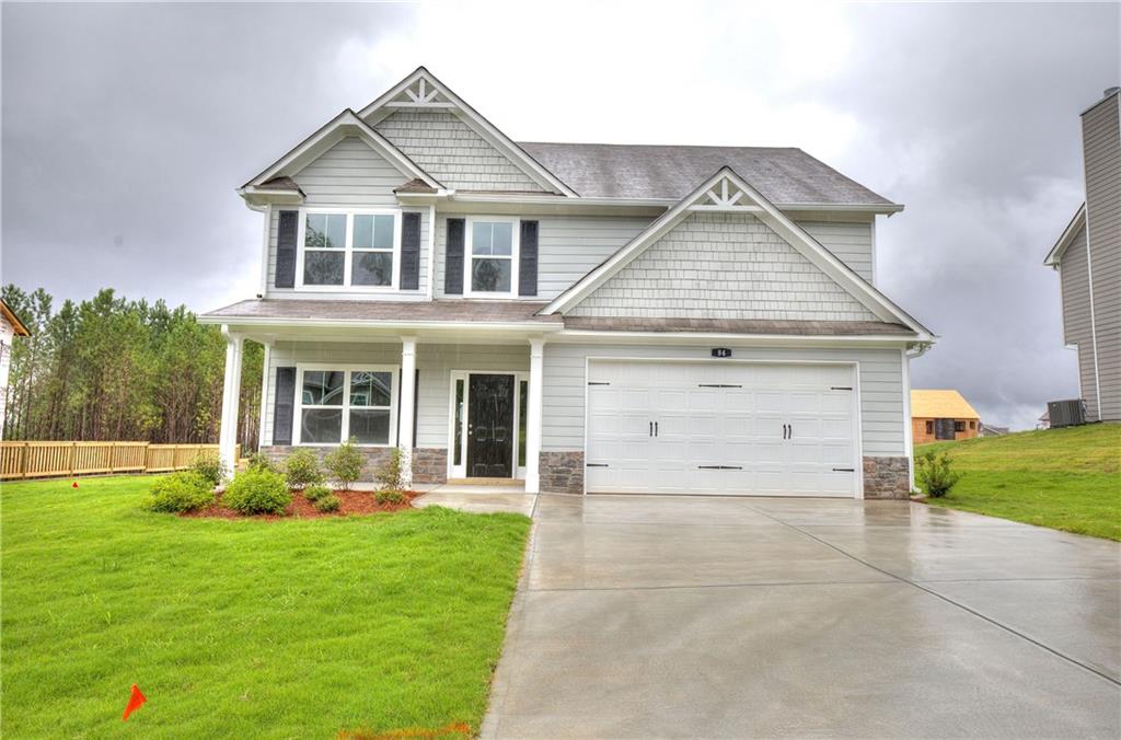 front view of a house with a yard