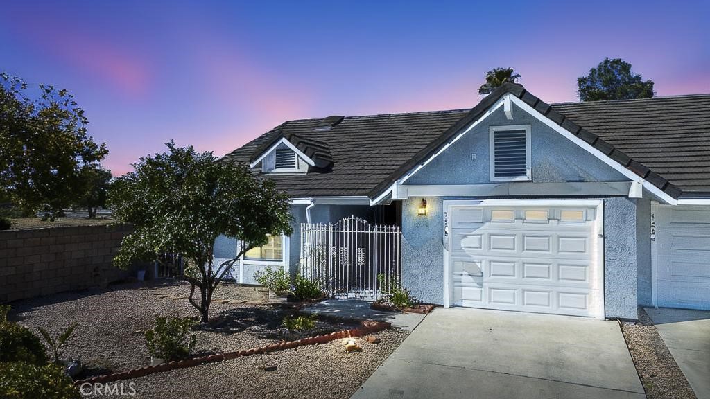 a front view of a house with garage