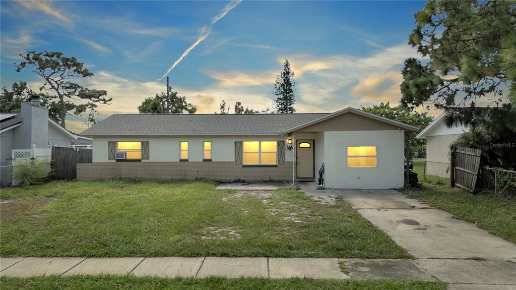 a view of a house with a yard