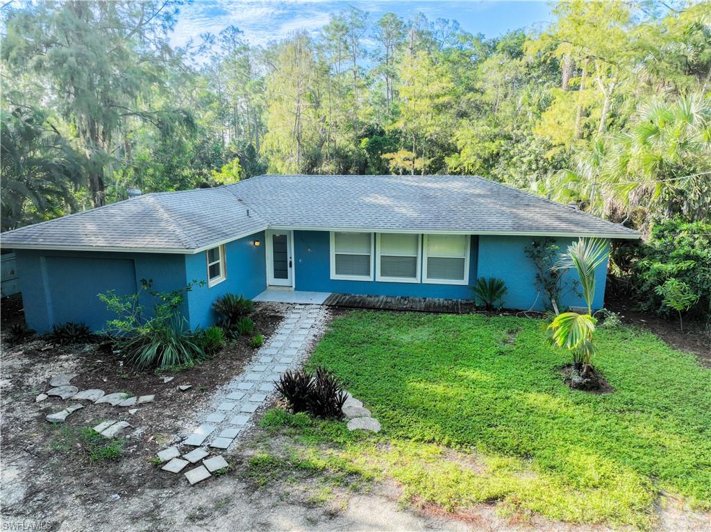 Ranch-style home with a front lawn