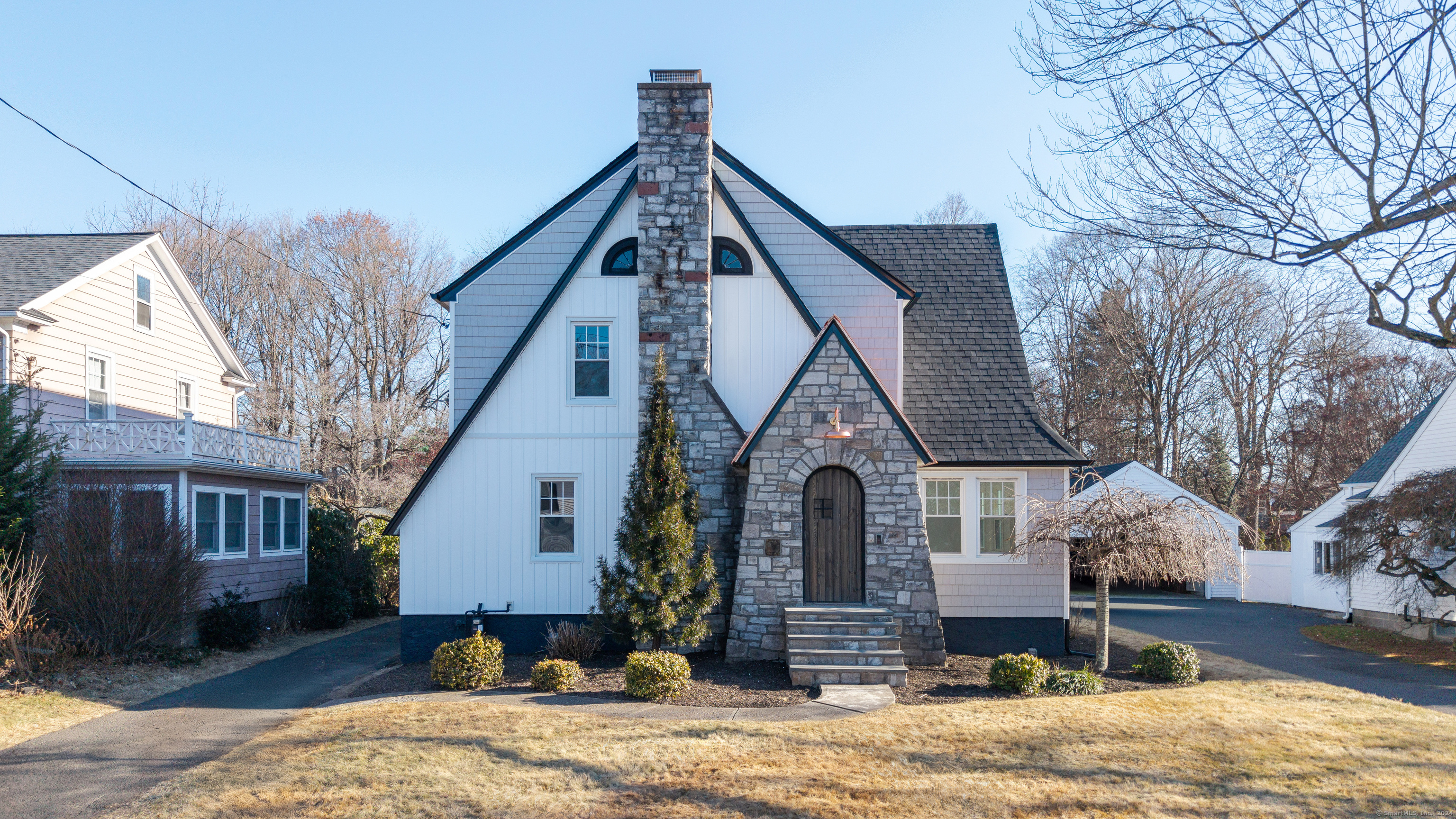 a front view of a house with garden