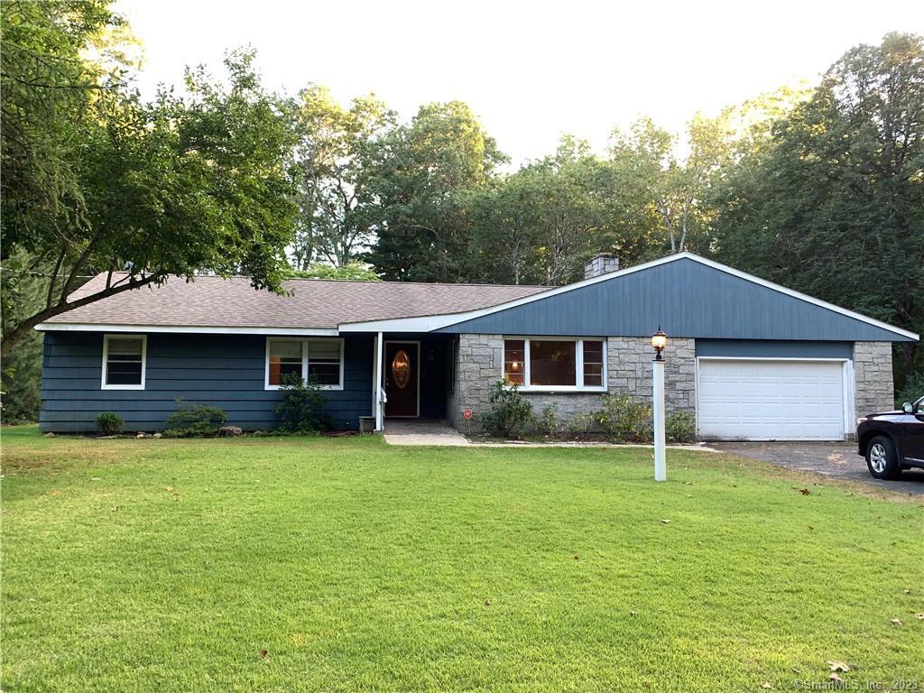 a front view of a house with yard