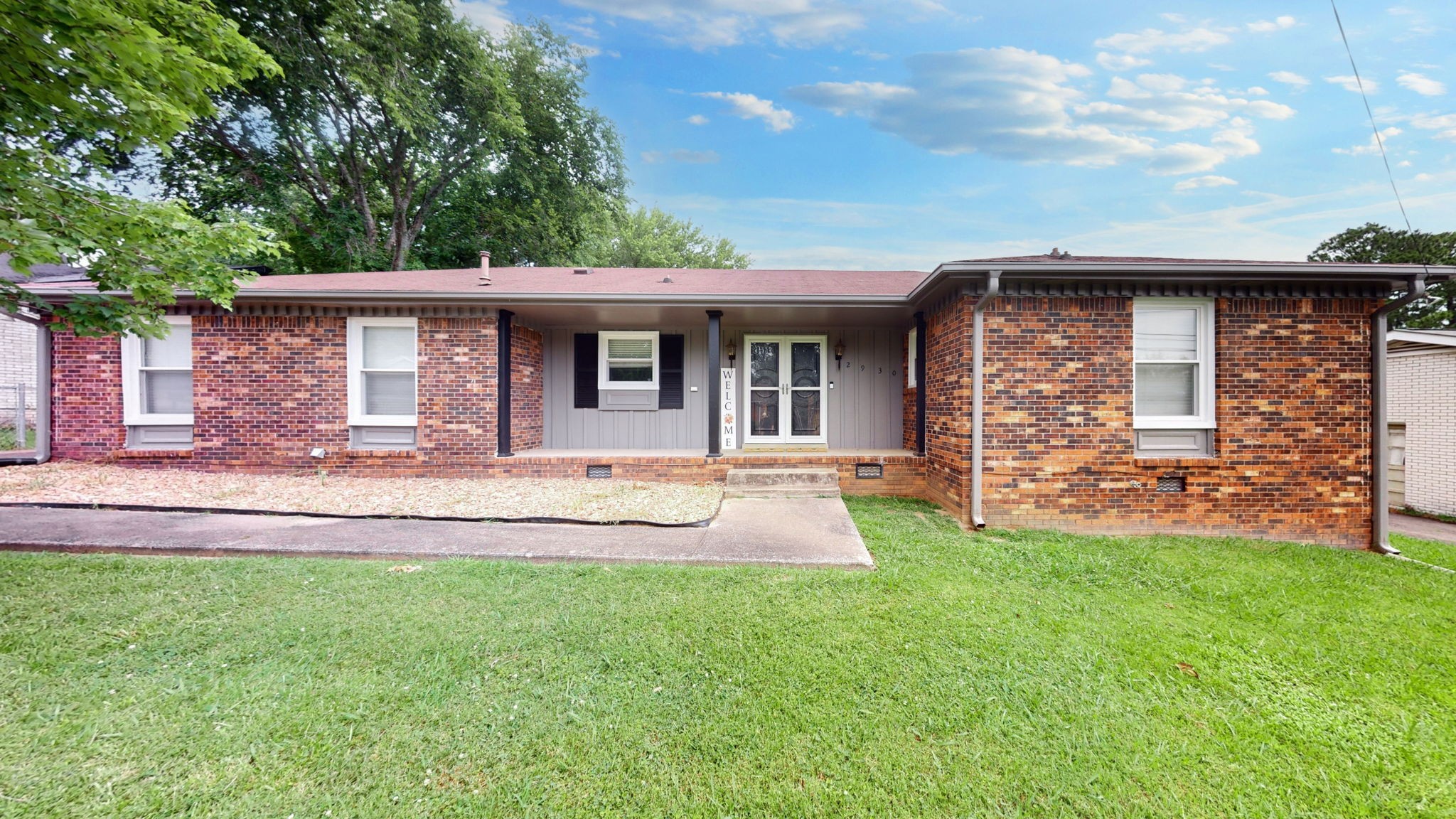 a front view of a house with a yard