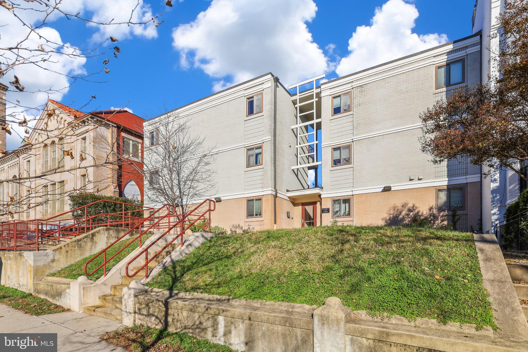 a view of a building with a yard