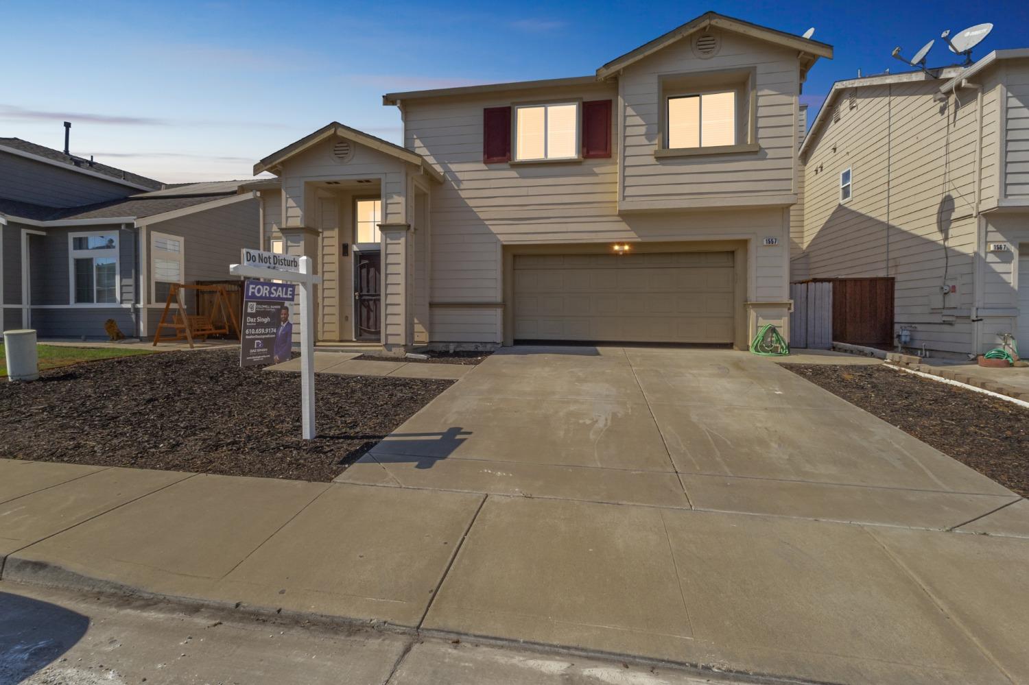 a front view of a house with yard