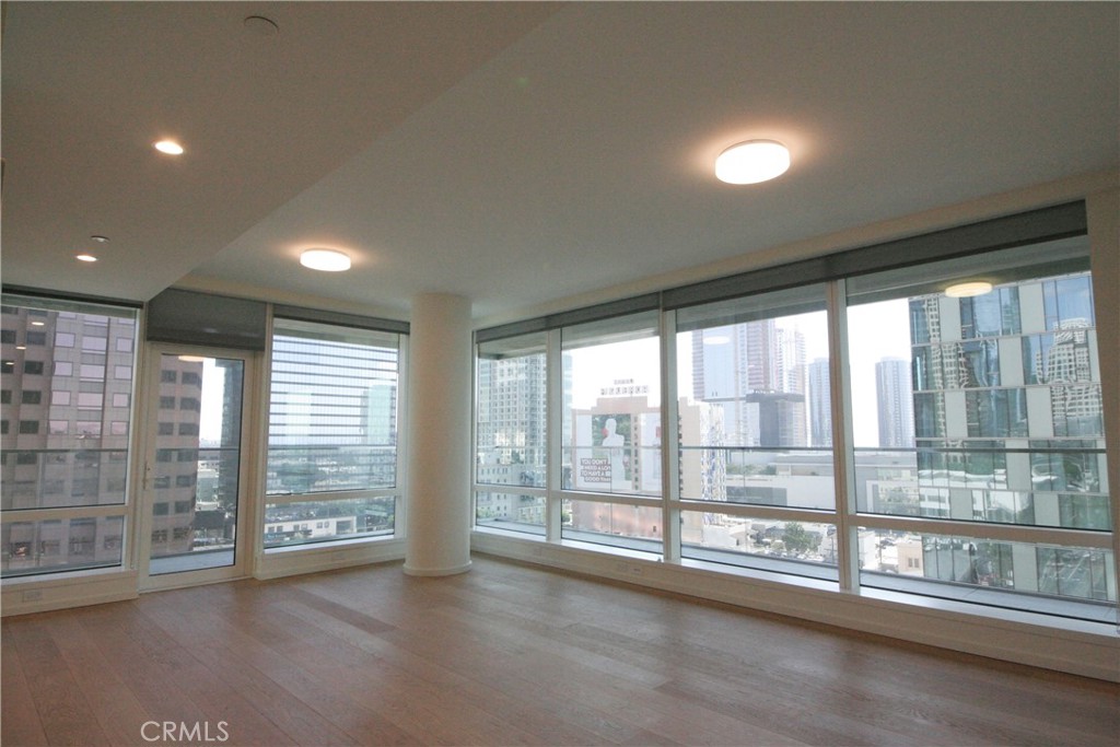 a view of an empty room with a balcony