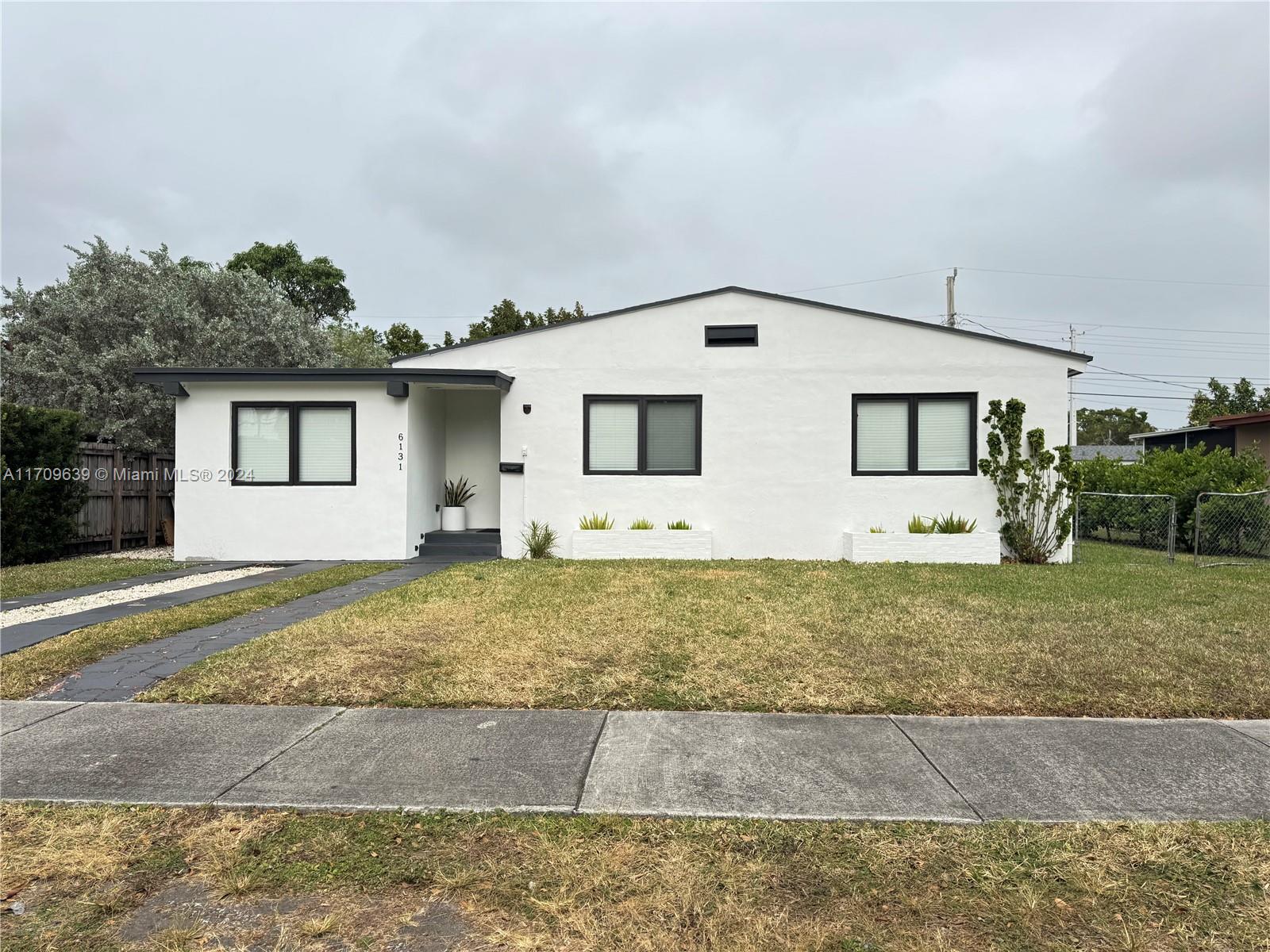 a front view of house with yard