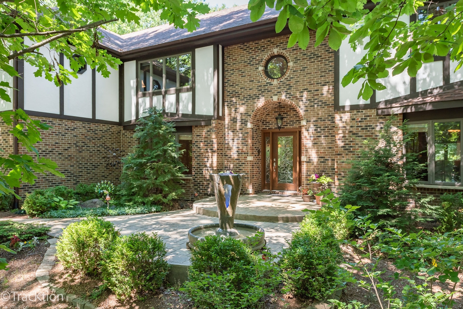 a front view of a house with garden