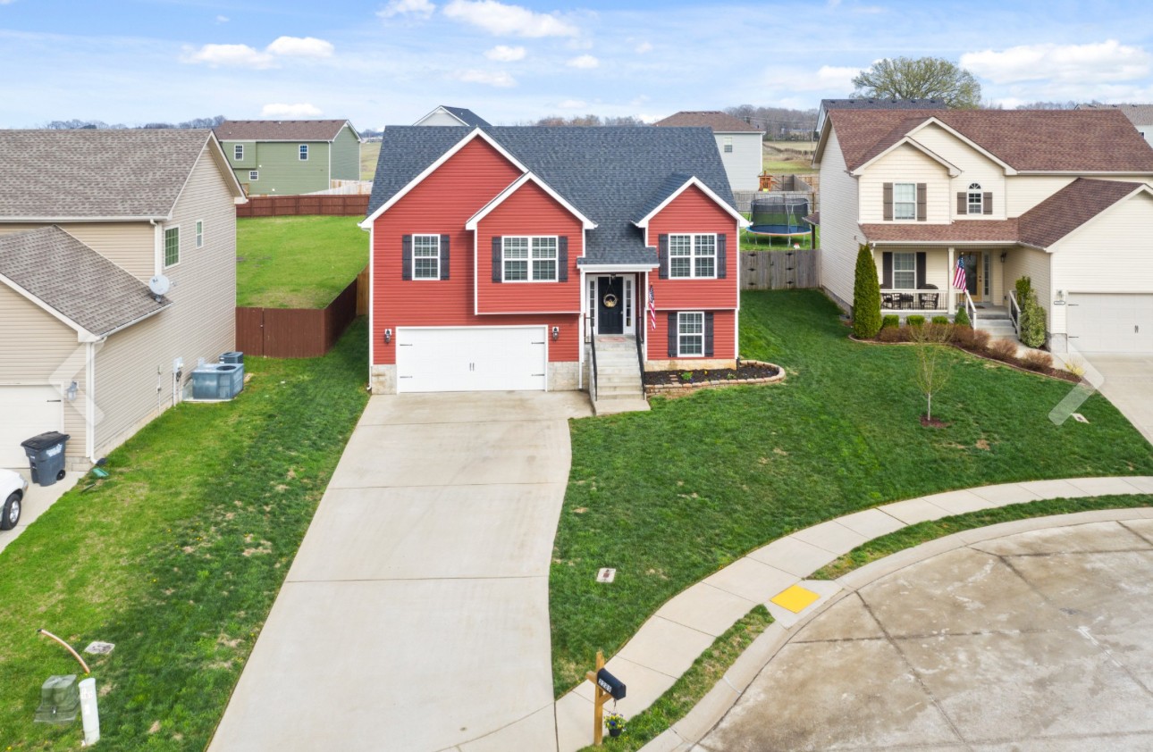 a front view of a house with yard