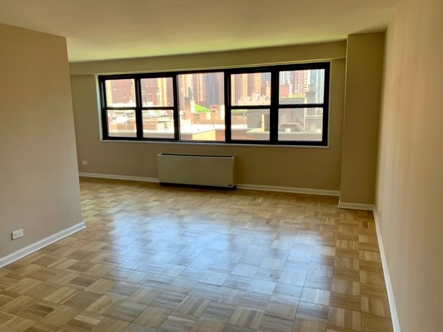 a view of an empty room with a window