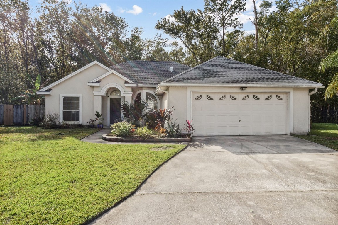 a front view of a house with yard