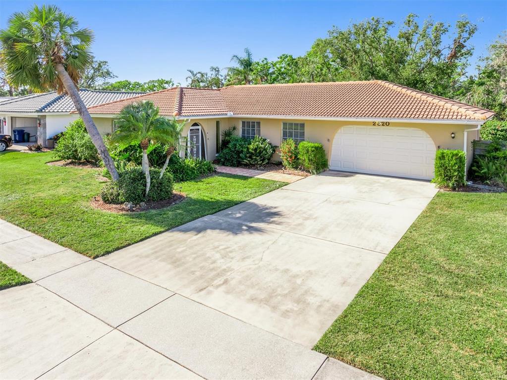 a view of a house with a yard