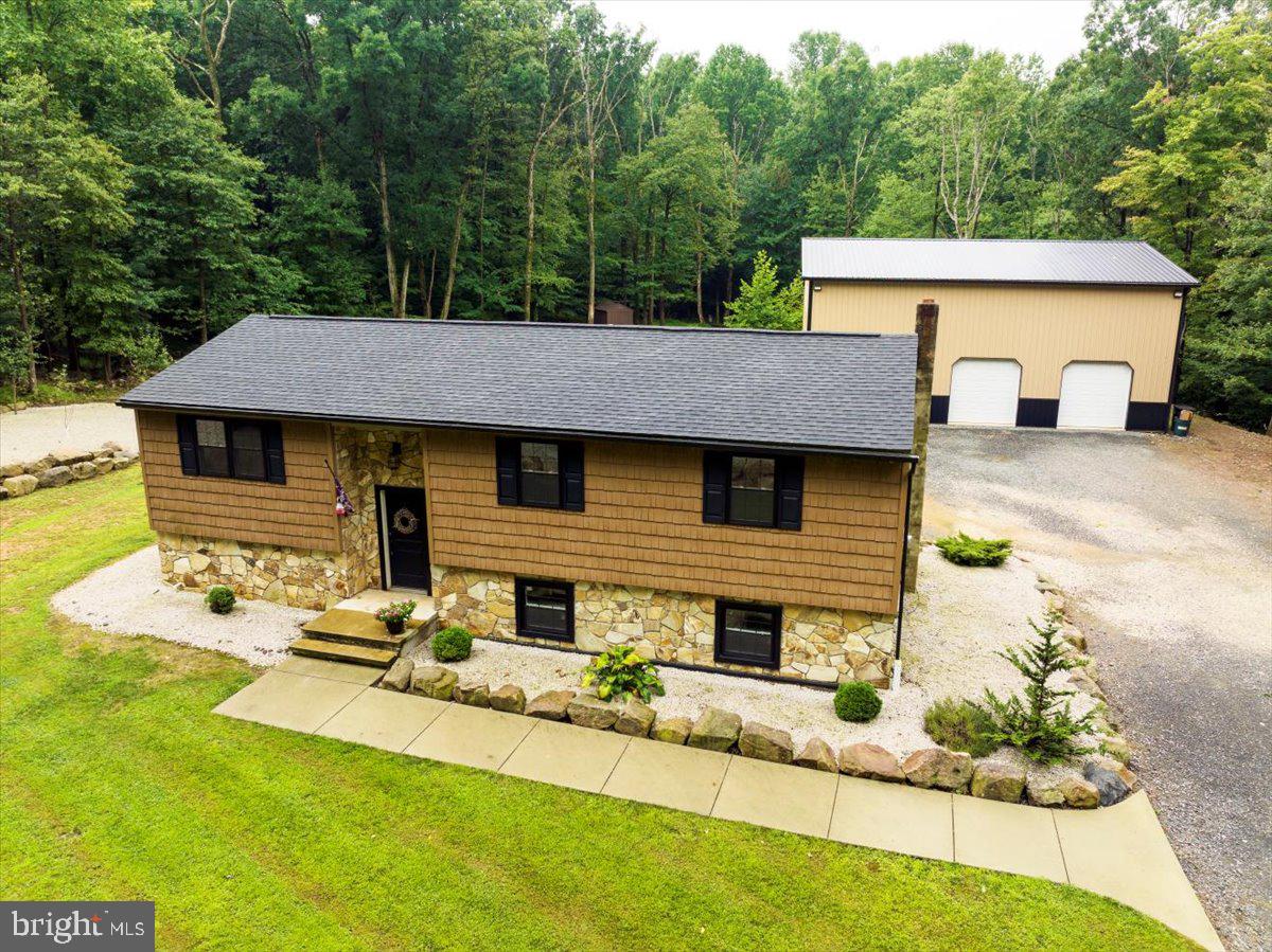 a aerial view of a house with swimming pool and sitting area